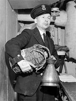 Coxwain sorting out the rum ration