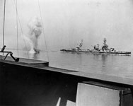 Heavy German coast artillery shell falls between USS Texas and USS Arkansas - June 1944